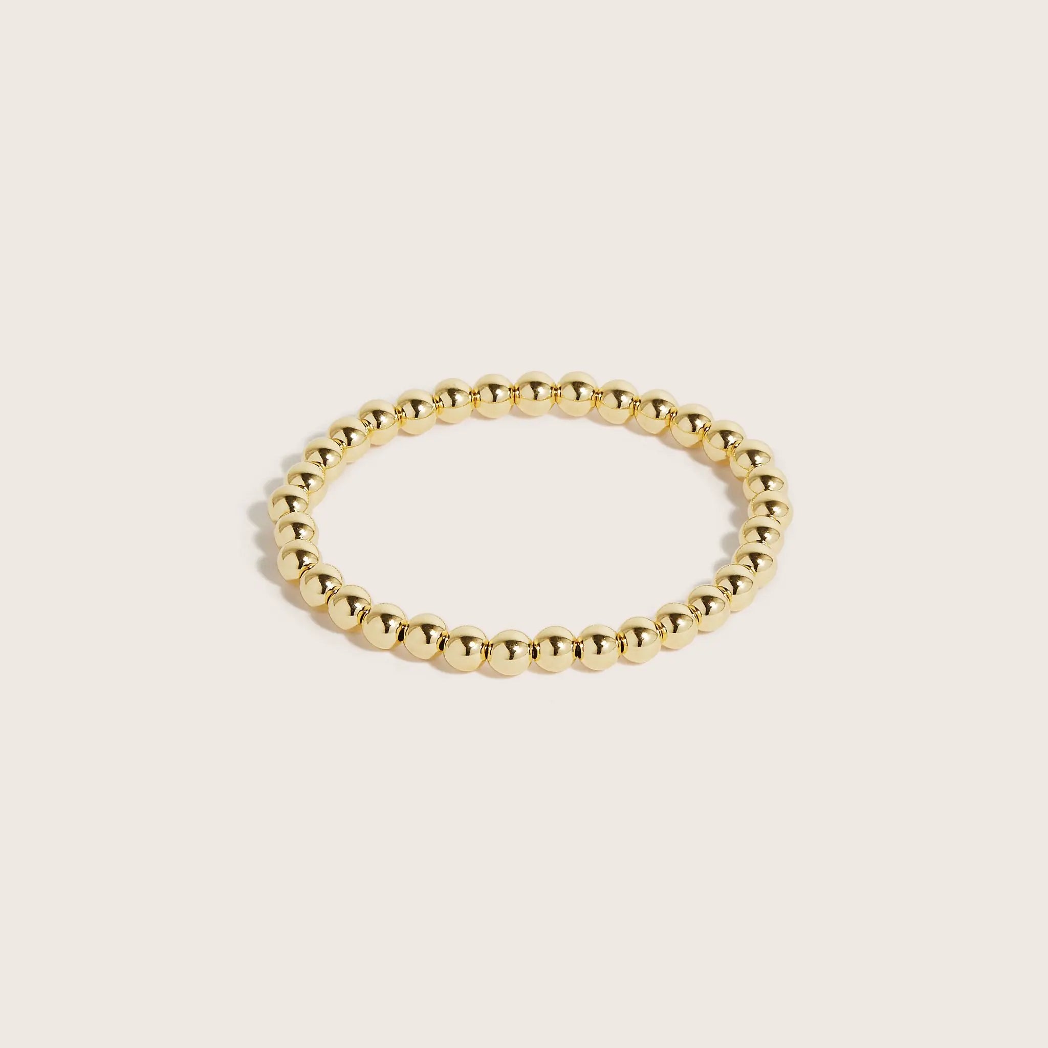 14K-gold-filled-gilda-bracelets-on-a-woman's-wrist