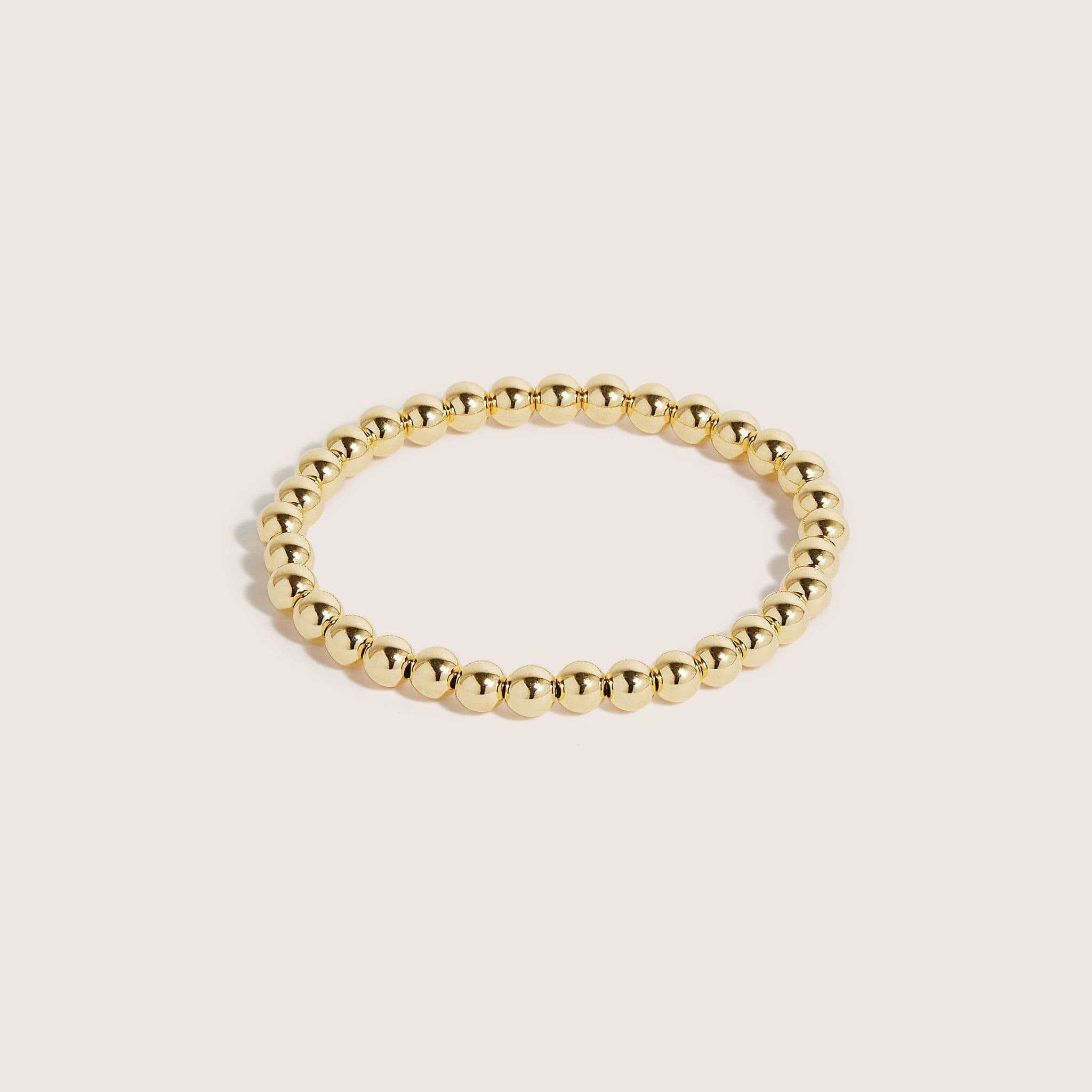 14K-gold-filled-gilda-bracelets-on-a-woman's-wrist