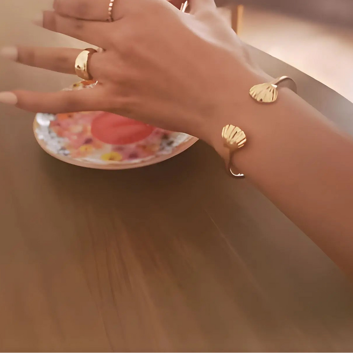 14K Gold Vermeil Dome Elysse ring on hand with Oyster of Nerida cuff bangle on wrist close up - demi-fine jewellery by Margot Georgia