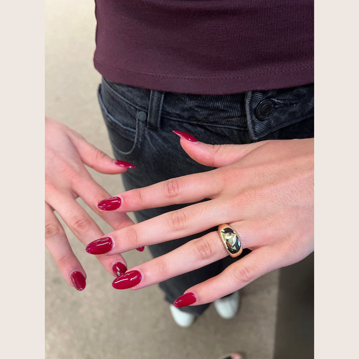 Close up 14K gold vermeil dome elysse ring on hand