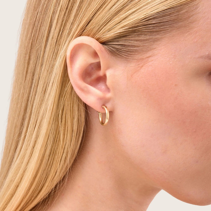 14K Gold Filled Carmela hoop earrings 15mm close-up on woman - demi-fine jewellery by Margot Georgia