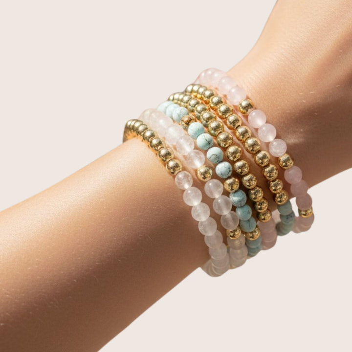 Stack of 14 Gold Filled Gilda bracelet with natural gemstones worn on wrist - demi-fine jewellery by Margot Georgia