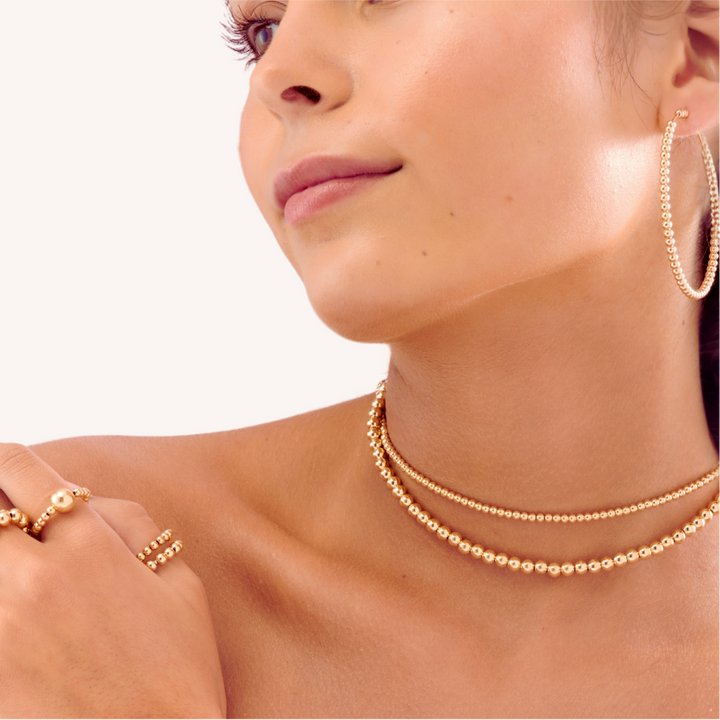 Close-up of a woman wearing 14K Gold Filled Gilda collection - demi-fine jewellery by Margot Georgia