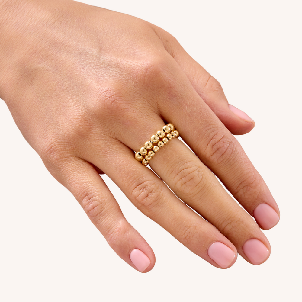 14K Gold Filled  Gilda stacking rings on hand close up - demi-fine jewellery  by Margot Georgia