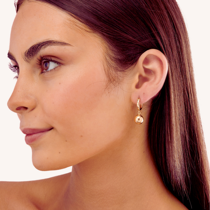 Close-up of young lady wearing 14K Gold Filled Golden Orb earrings - demi-fine jewellery by Margot Georgia