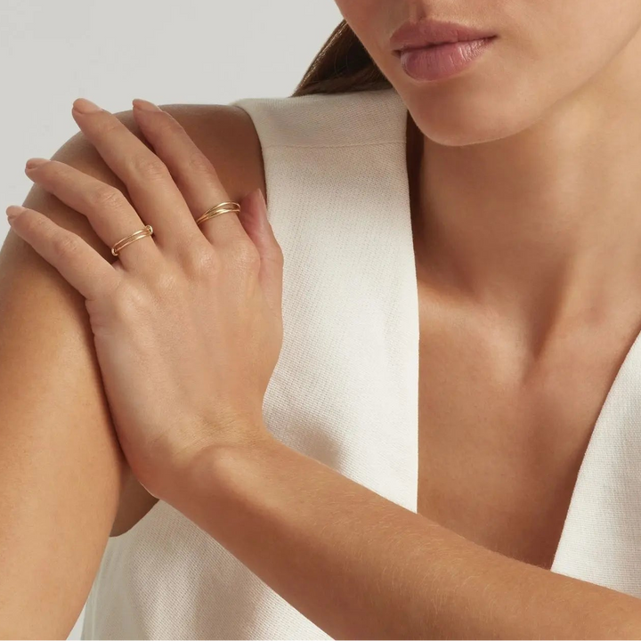 Woman wearing 14K Gold Filled Interlocking and Mae rings - demi-fine jewellery by Margot Georgia