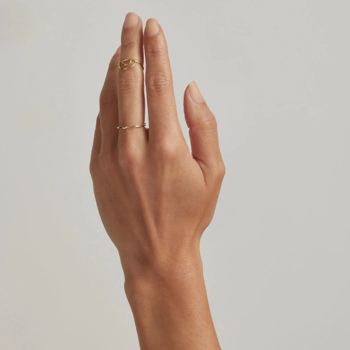 Hand wearing 14K Gold Filled Iridiana and Gal Wave stacking rings - demi-fine jewellery by Margot Georgia