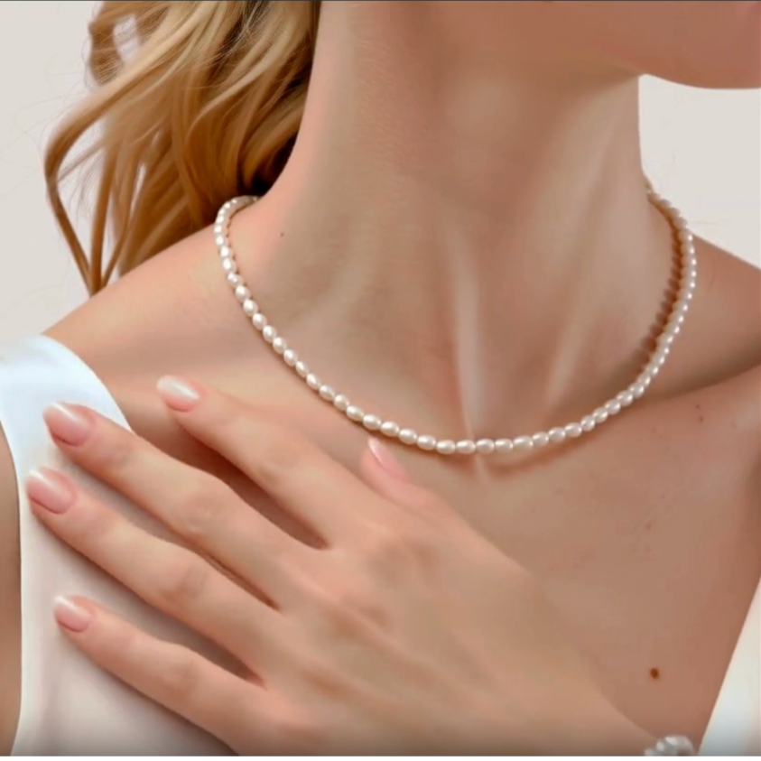 Model wearing 14K Gold Filled Lucine string of rice pearl necklace - demi-fine jewelleryb y Margot Georgia