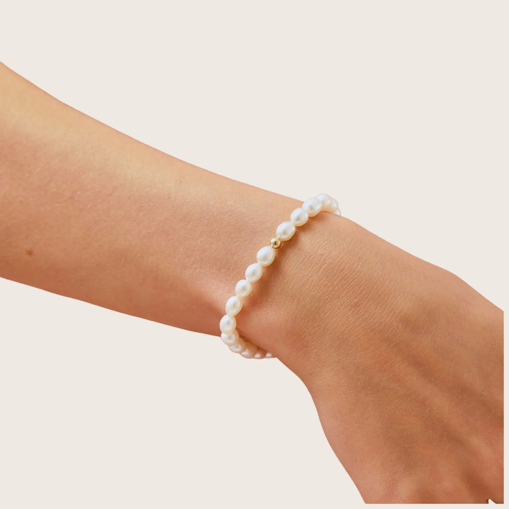 14K Gold Filled Luna freshwater pearl bracelet on wrist - demi-fine jewellery by Margot Georgia