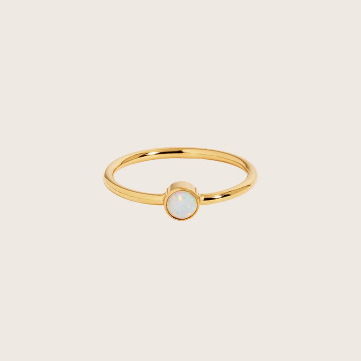 14K gold filled stacking ring with a small round imitation opal gemstone 