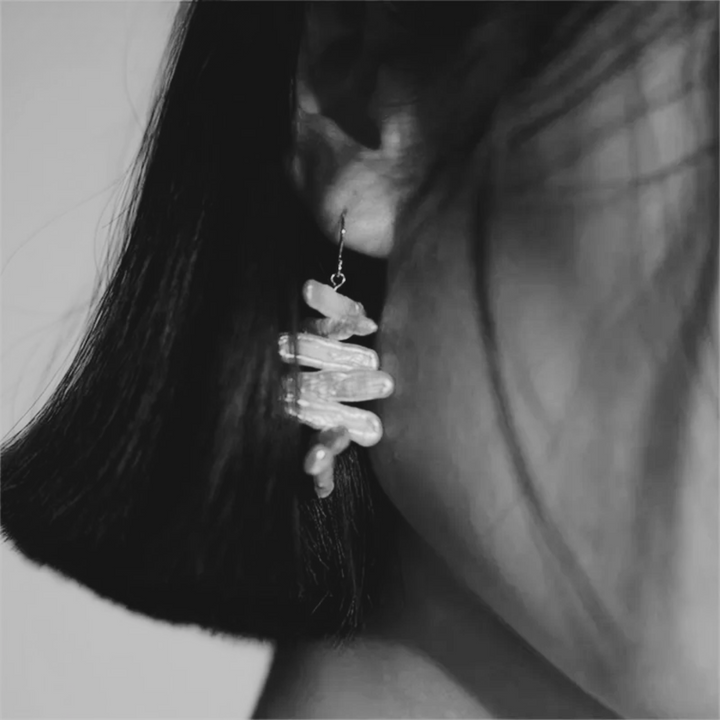 Close-up of a woman wearing 14K Gold Filled Recta Baroque Pearl Drop earrings - small