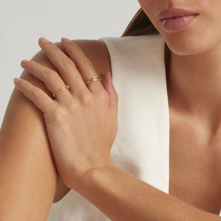 Woman wearing 14K Gold Filled Mae and Interlocking stacking rings - demi-fine jewellery by Margot Georgia