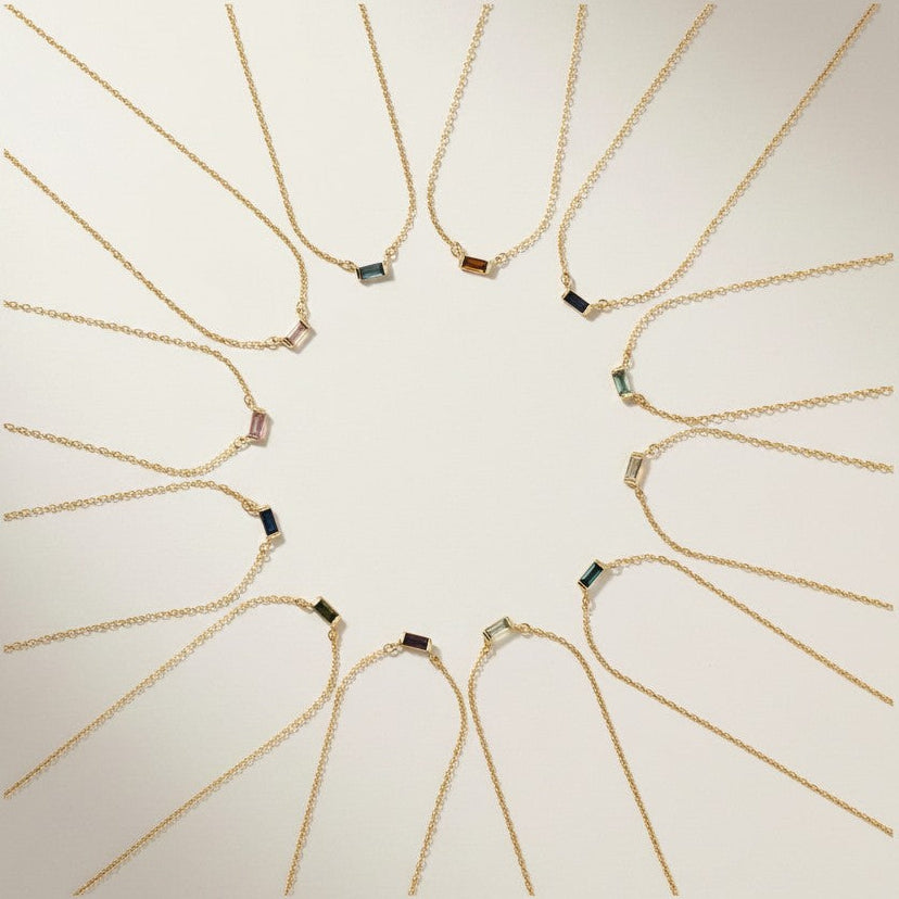 18K Gold Plated Baguette Birthstone Bar necklaces all months arranged in a circular pattern 