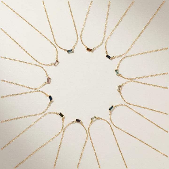 18K Gold Plated Baguette Birthstone Bar necklaces all months arranged in a circular pattern 