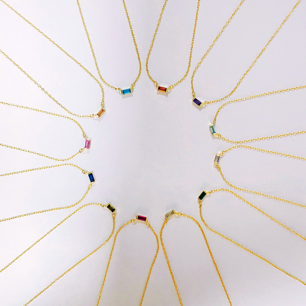 18K Gold Plated Baguette Birthstone Bar necklaces with small coloured pendants arranged in a circular pattern  - demi-fine jewellery by Margot Georgia