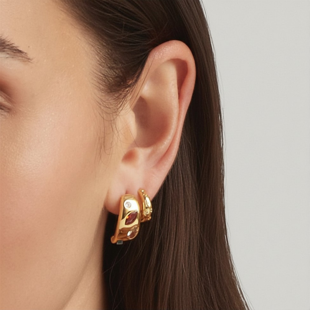 Close-up of a woman wearing 18K Gold Plated Candy Gem and Astrid Huggie earrings - demi-fine jewellery by Margot Georgia