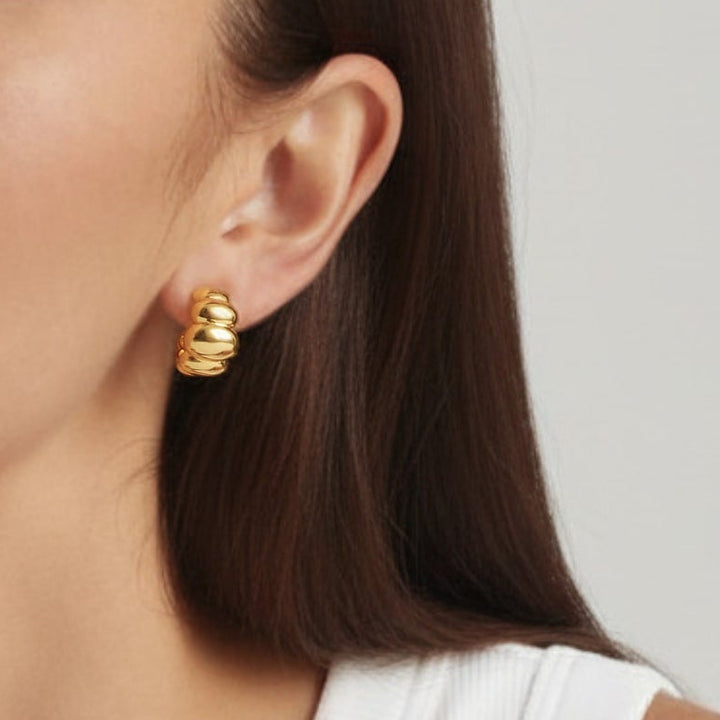 Woman wearing 18K Gold Plated Croissant  Dome drop earrings close-up - demi-fine jewellery by Margot Georgia
