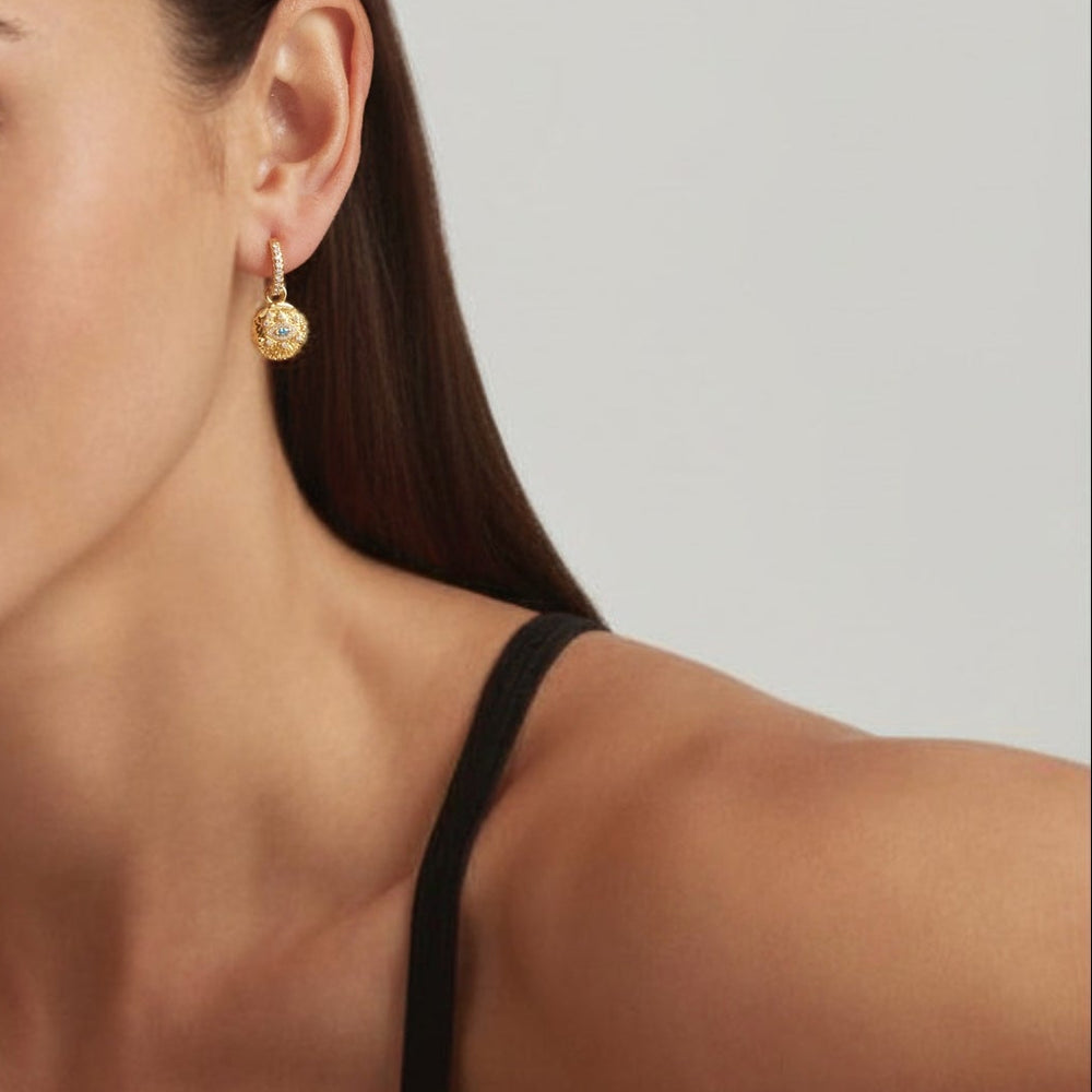 Close-up of woman wearing 18K Gold Plated Vintage Evil Eye hoop earrings - demi-fine jewellery by Margot Georgia