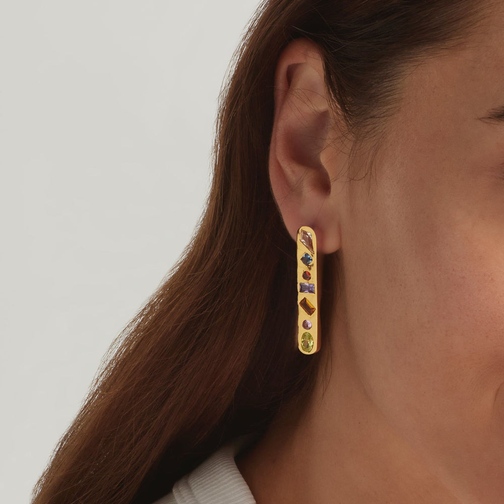 Close-up of 18K Gold Vermeil Candy Luxe earrings on woman