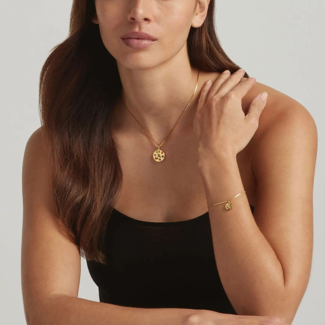 Woman wearing the 18K Gold Vermeil Candy Luxe necklace and bracelet set - demi-fine jewellery by Margot Georgia