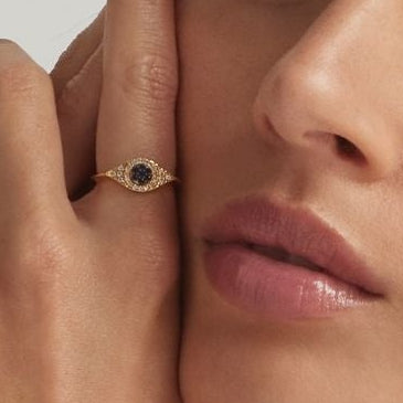 Close up of 18K Gold Vermeil Jacalin Evil Eye Ring on finger - demi-fine jewellery by Margot Georgia