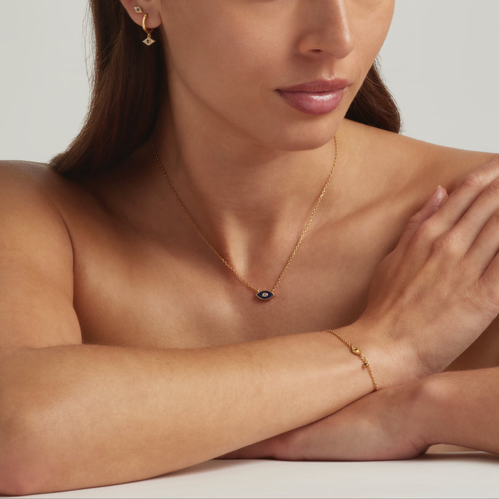 Model wearing the full 18K Gold Vermeil Jacalin Evil Eye set - demi-fine jewellery by Margot Georgia