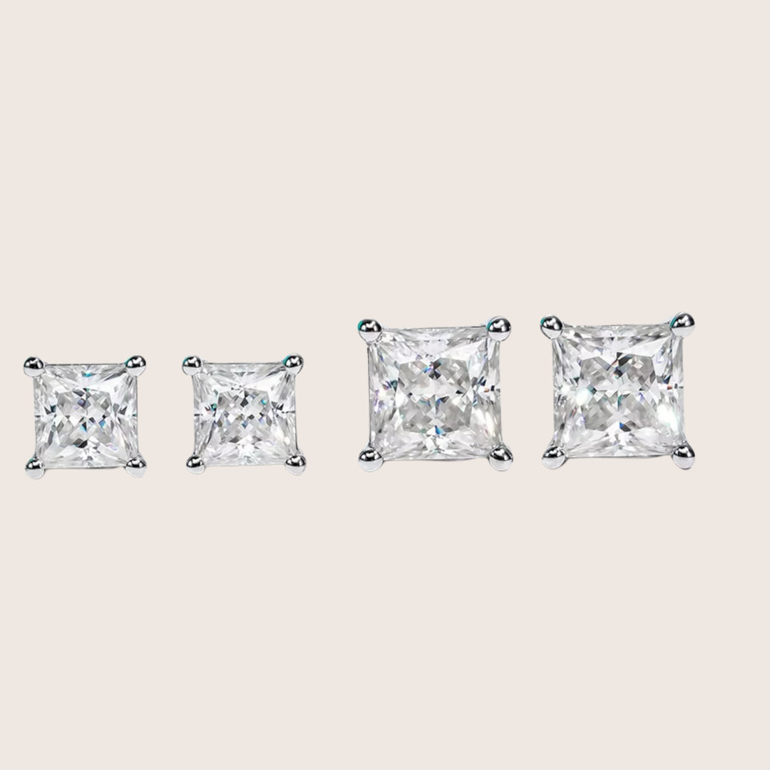 A size comparison of 2 CTTW and 4 CTTW 18K White Gold Diamante Moissanite stud earrings in white