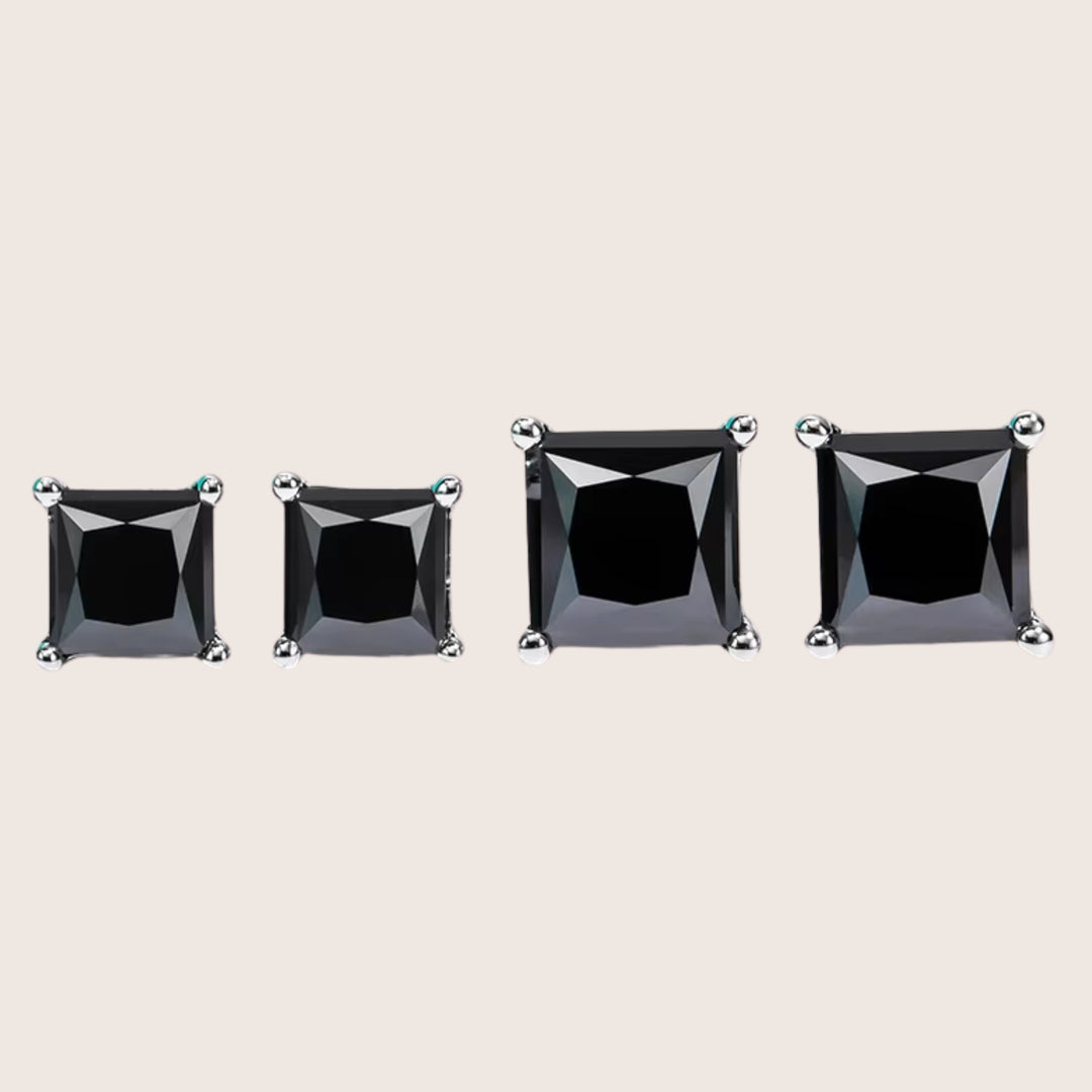 Front view of 18K White Gold Diamante Moissanite stud earrings in black in two sizes 2 CTTW and 4 CTTW