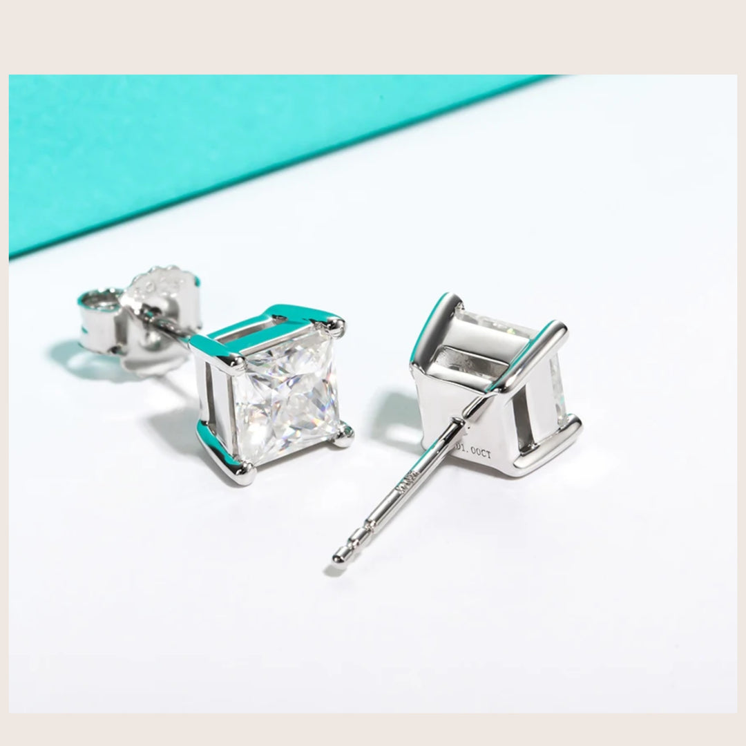 An angled view of 18K White Gold Diamante Moissanite stud earrings in white