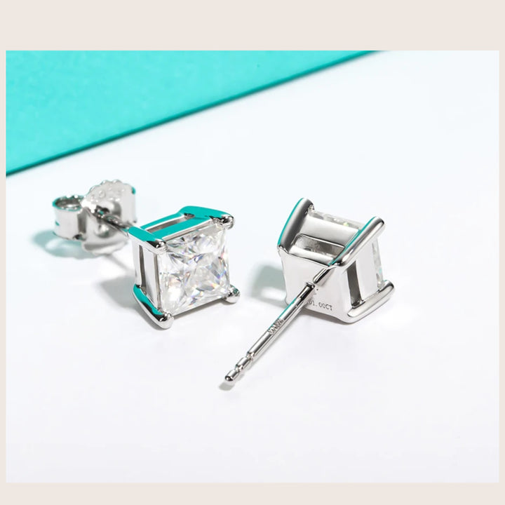 An angled view of 18K White Gold Diamante Moissanite stud earrings in white