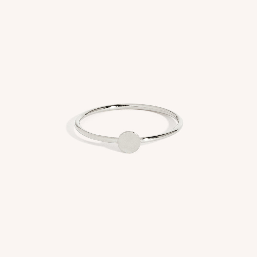 A 925 sterling silver ring with a central dot design, displayed against a white background.