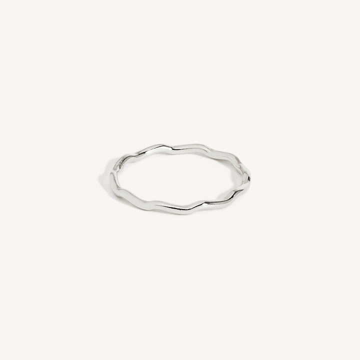 A 925 sterling silver stacking ring with a wave pattern on a white background.