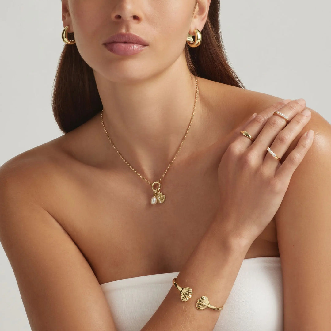 Woman wearing Ocean of Nereid collection - demi-fine jewellery by Margot Georgia